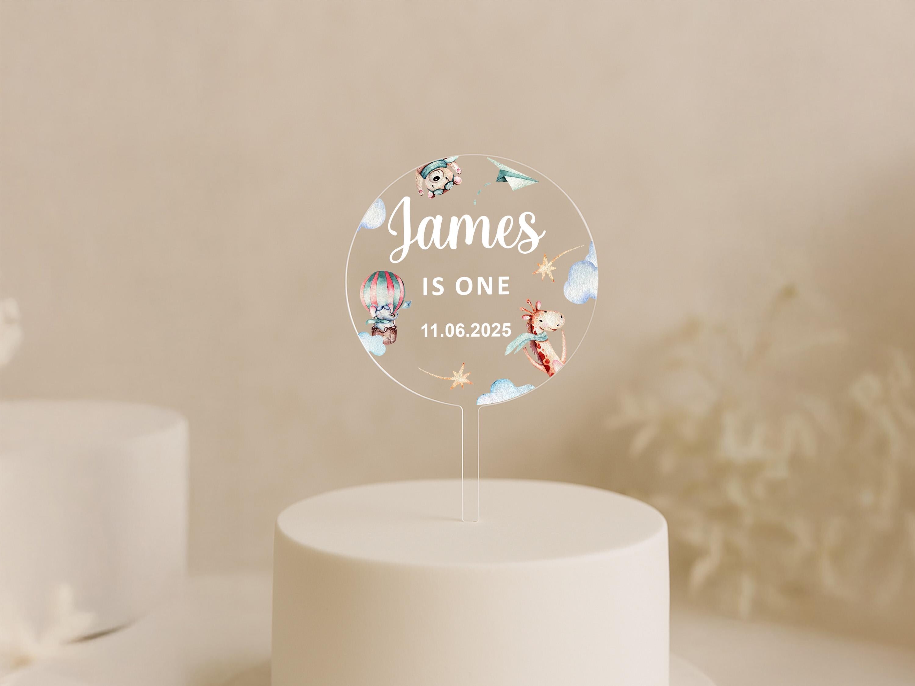 Giraffe and hot air balloon cake topper on clear acrylic