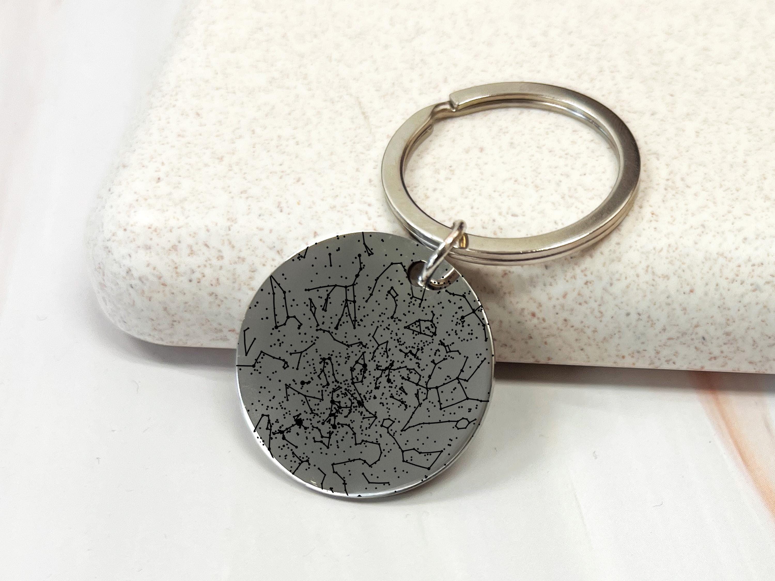 Personalized couple star map keychain showing night sky constellation from special date, perfect anniversary gift