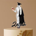 Personalised Muslim graduation cake topper with hijabi female graduate in cap and gown, custom name, and Class of 2025 on elegant two-tier cake.