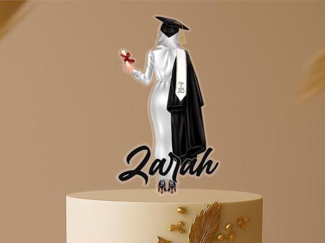 Personalised Muslim graduation cake topper with hijabi female graduate in cap and gown, custom name, and Class of 2025 on elegant two-tier cake.