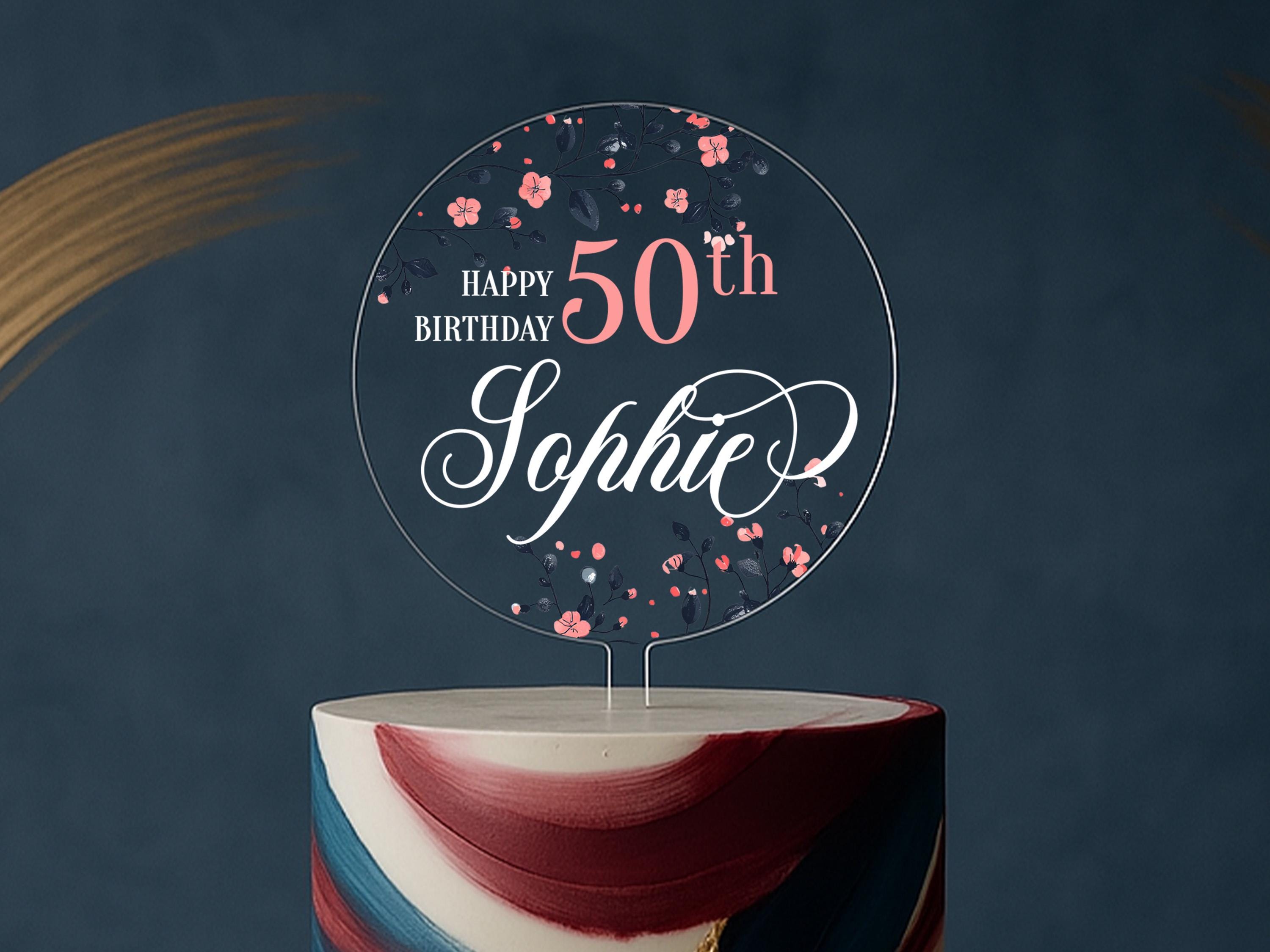 a birthday cake with a happy 50th sign on top