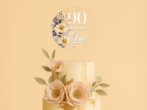 a three tiered cake with flowers on top