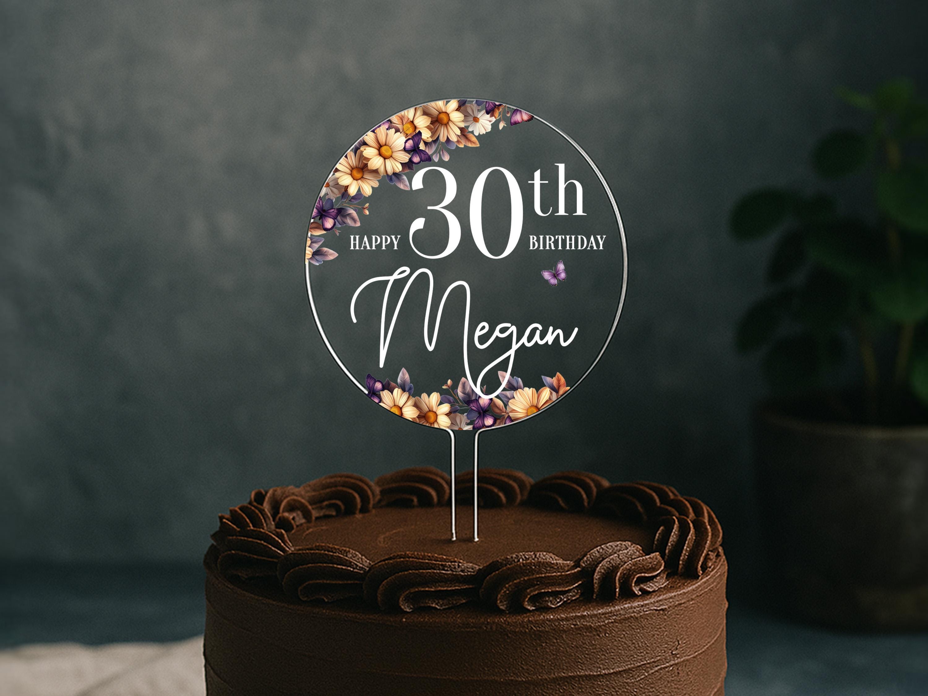 a chocolate cake with a happy 30th birthday sign on top