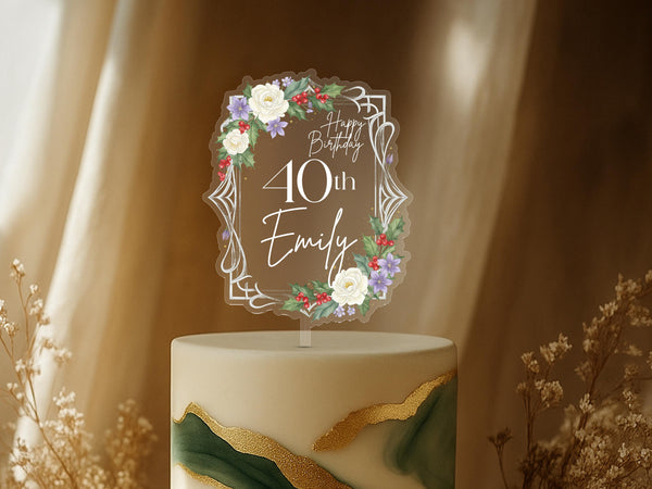 Personalised art deco birthday cake topper featuring geometric frame with white roses, purple flowers, red berries and Happy Birthday 40th Emily text on elegant green and gold celebration cake
