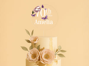 a three tiered cake with flowers on top of it