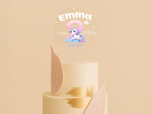 a birthday cake with a pink and gold frosting