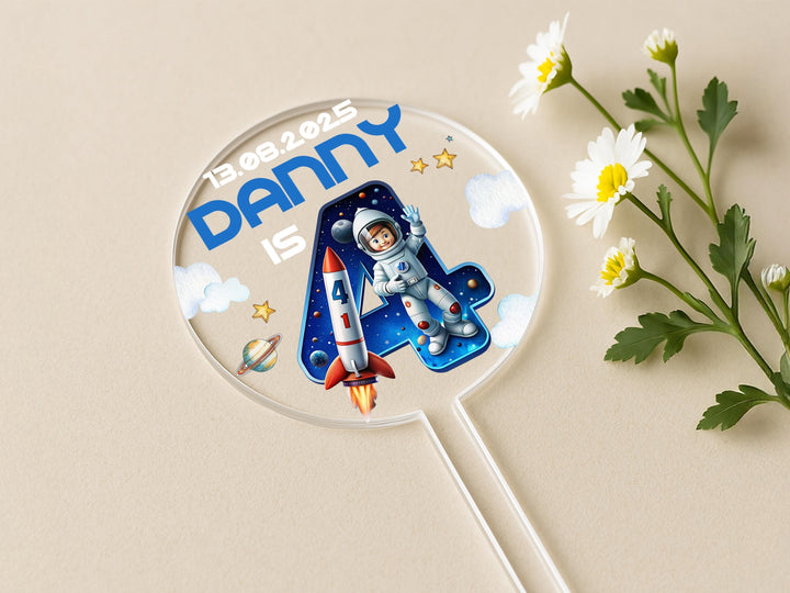 Close-up of custom space party cake decoration with planets and stars