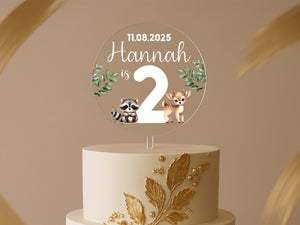 a two tiered cake with a couple of animals on top of it