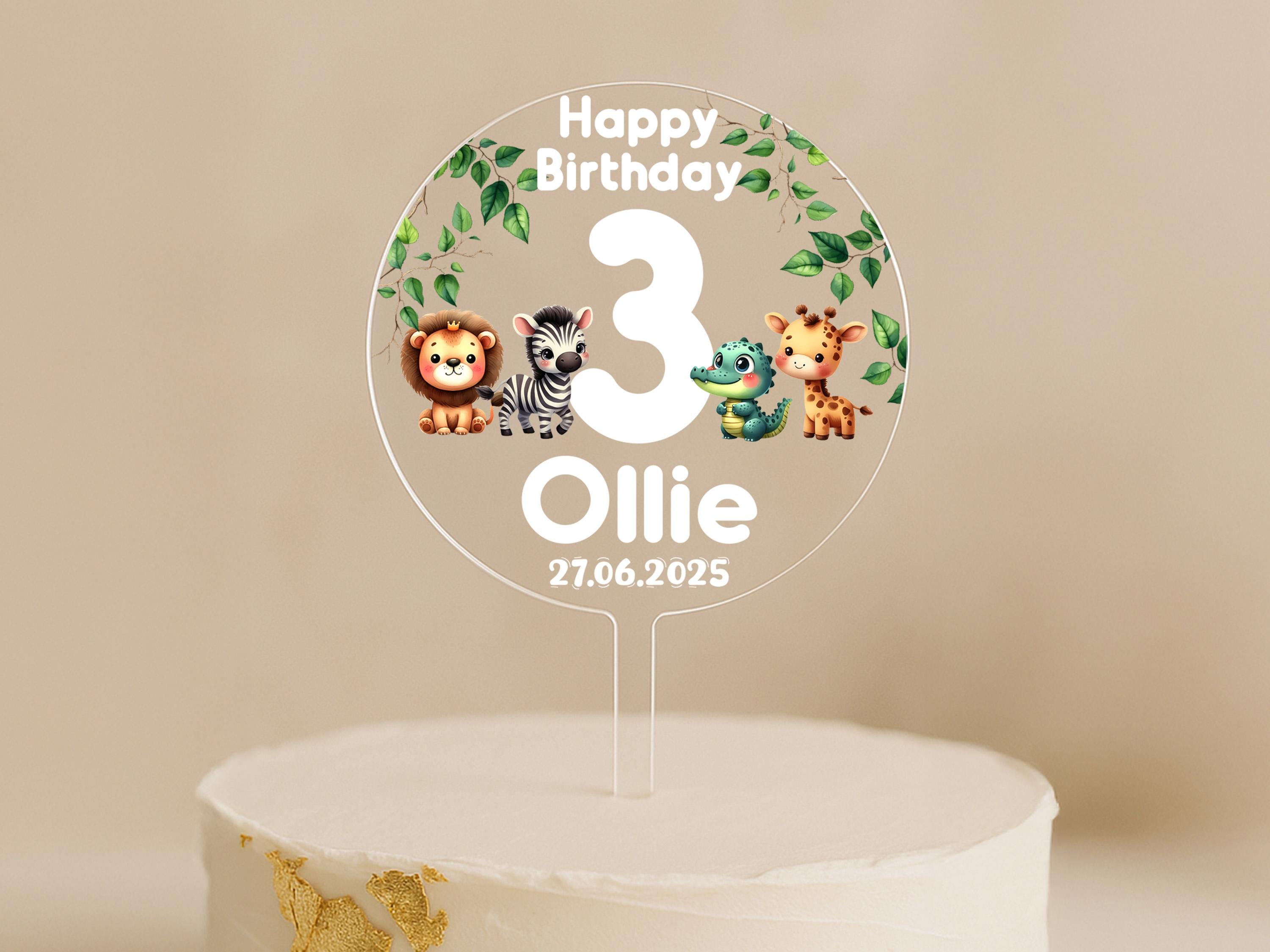 Personalised jungle animal cake topper featuring lion, zebra, crocodile, and giraffe with child's name and age.