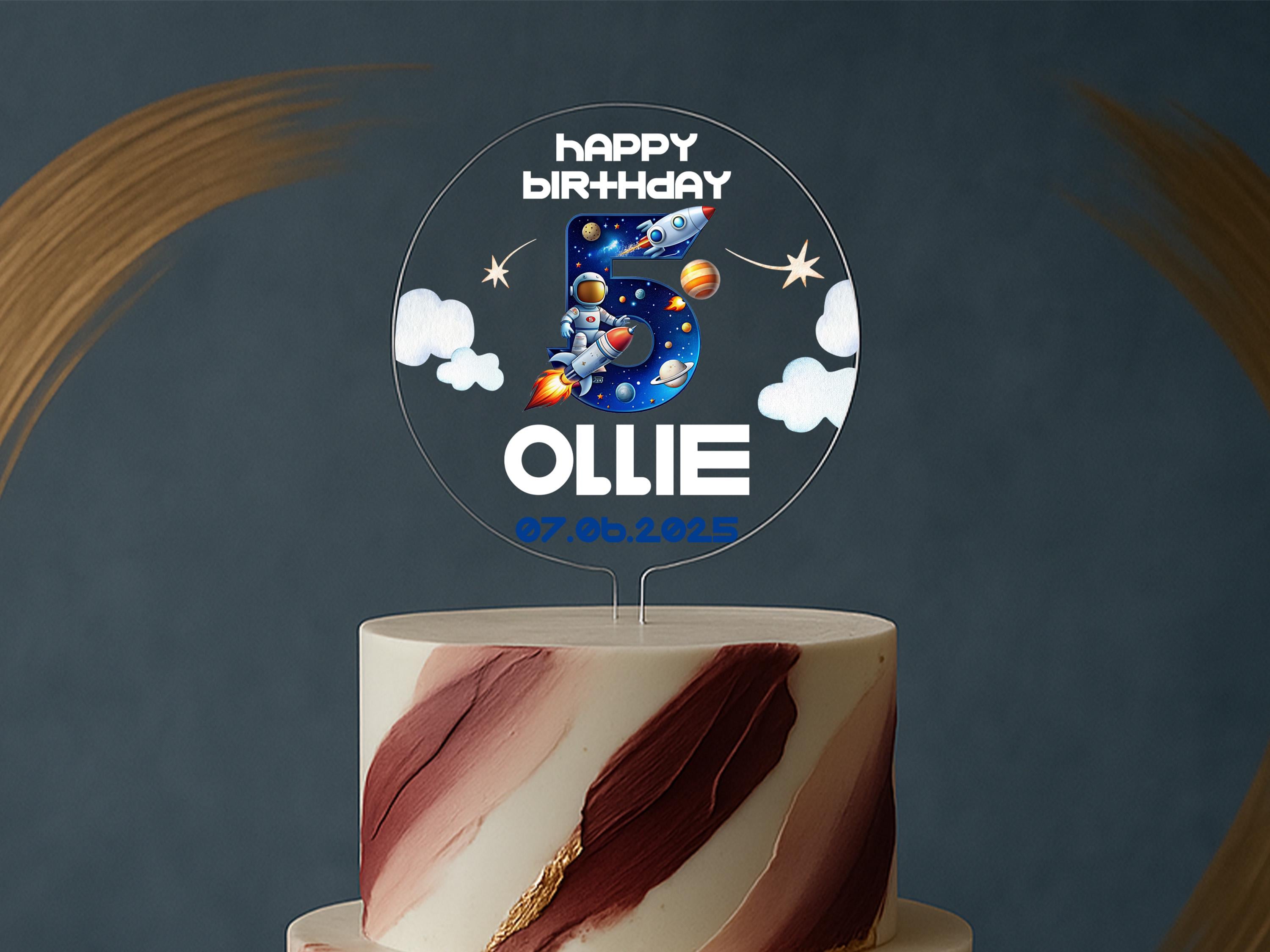 Kids birthday cake with personalised topper featuring stars and clouds