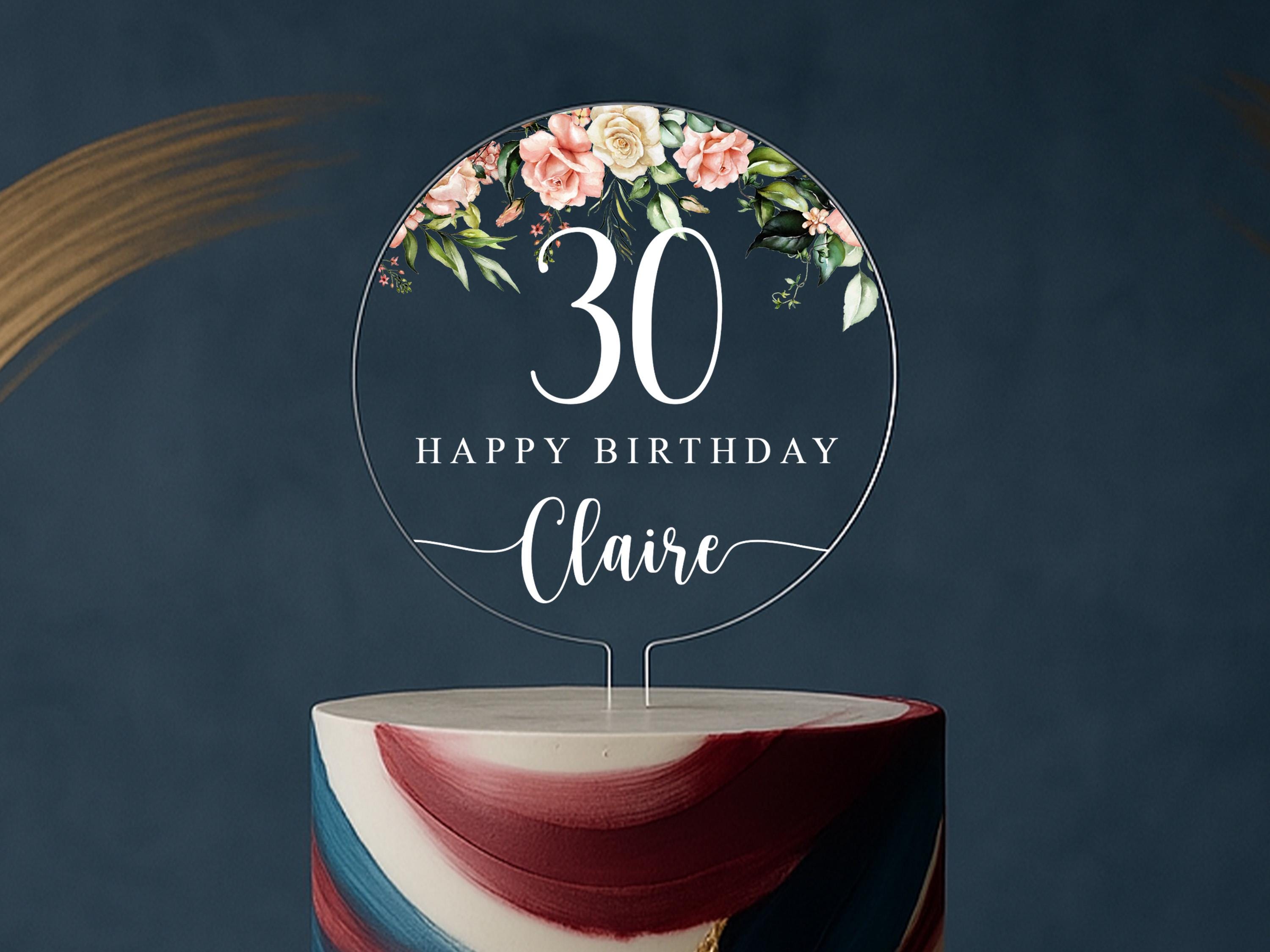 Personalized round clear acrylic birthday cake topper with peach floral design and custom name and age