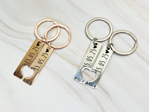 Black personalised couple keyring set, custom engraved with date and initials, romantic matching keychains for him and her.