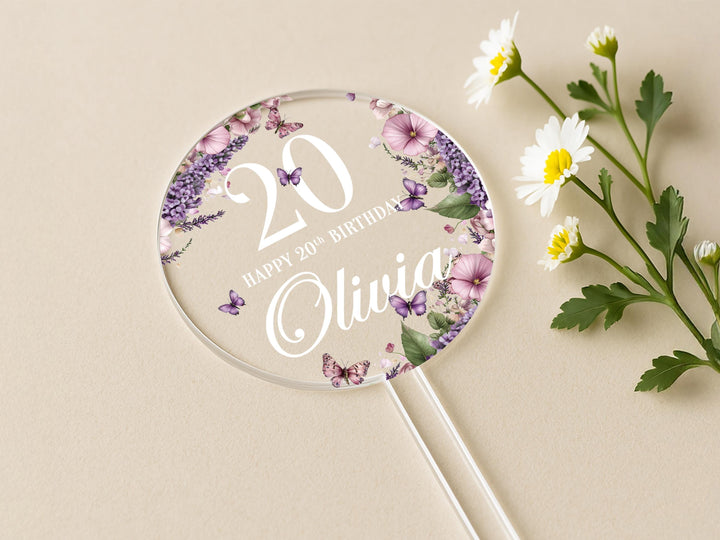 a purple and white flower and a personalized birthday lollipop