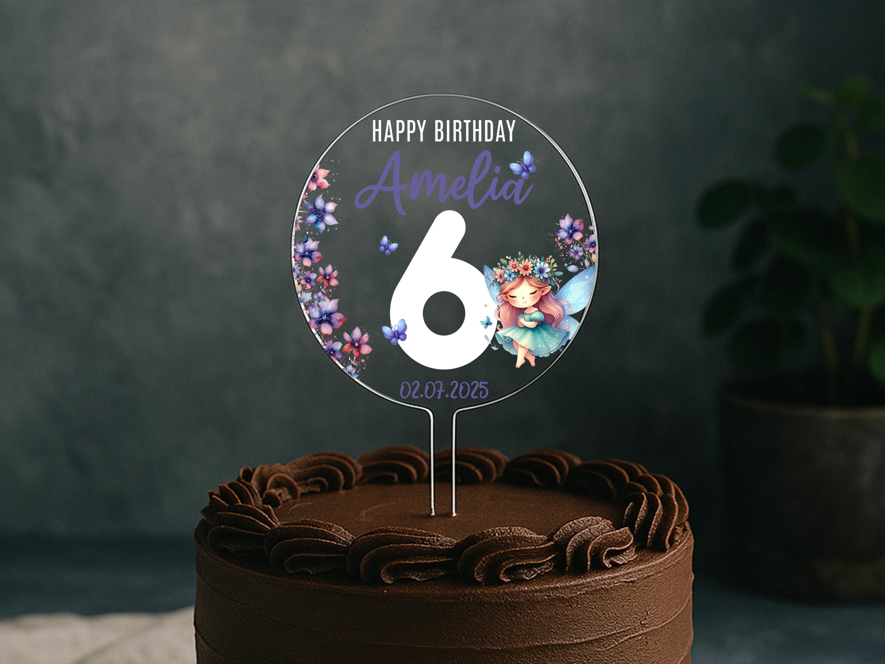 a birthday cake with the number six on it