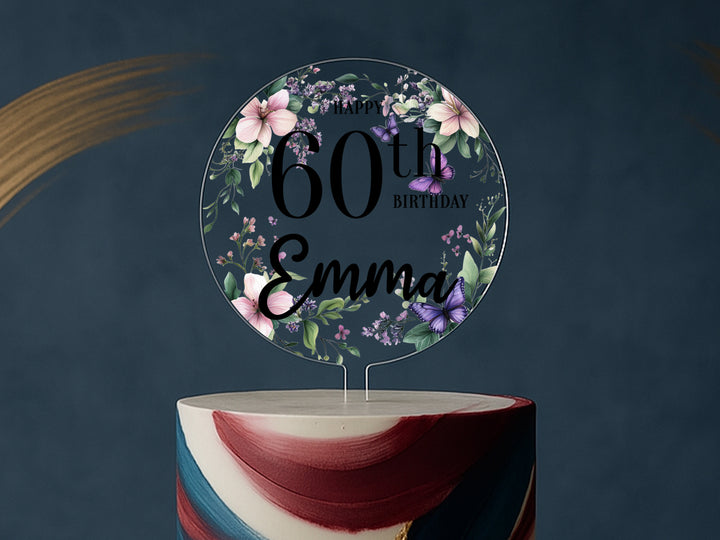a birthday cake with a floral cake topper