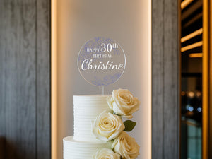 a white cake with white roses on top of it