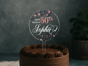 a chocolate cake with a happy 50th sign on top