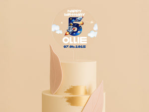 a birthday cake with a topper for a five year old