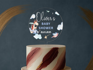 a baby shower cake with a horse on top