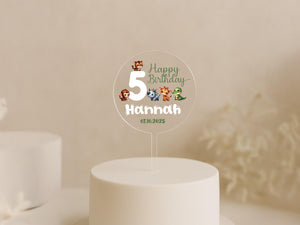a white cake with a white frosting number five on it