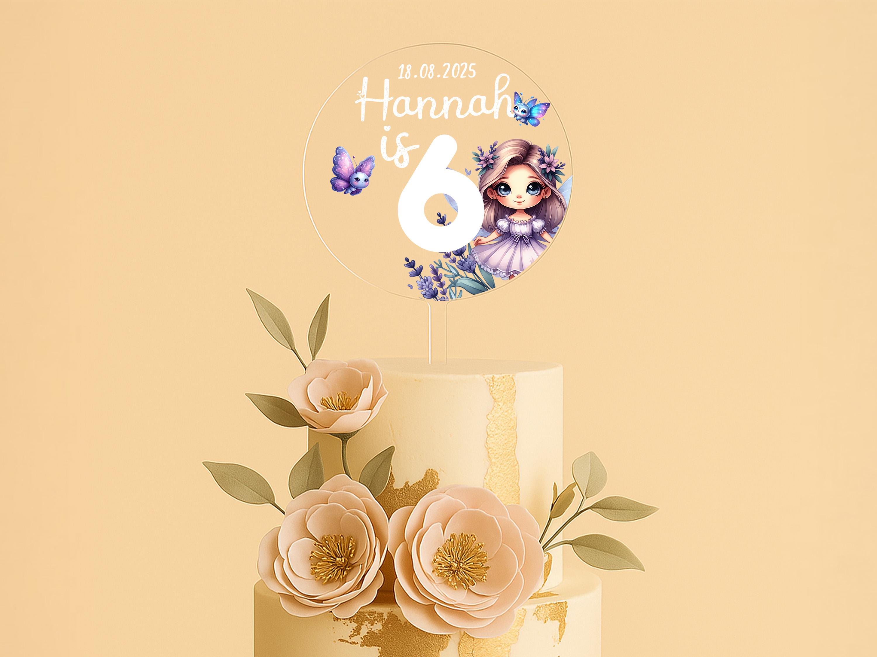 a three tiered cake with flowers on top of it