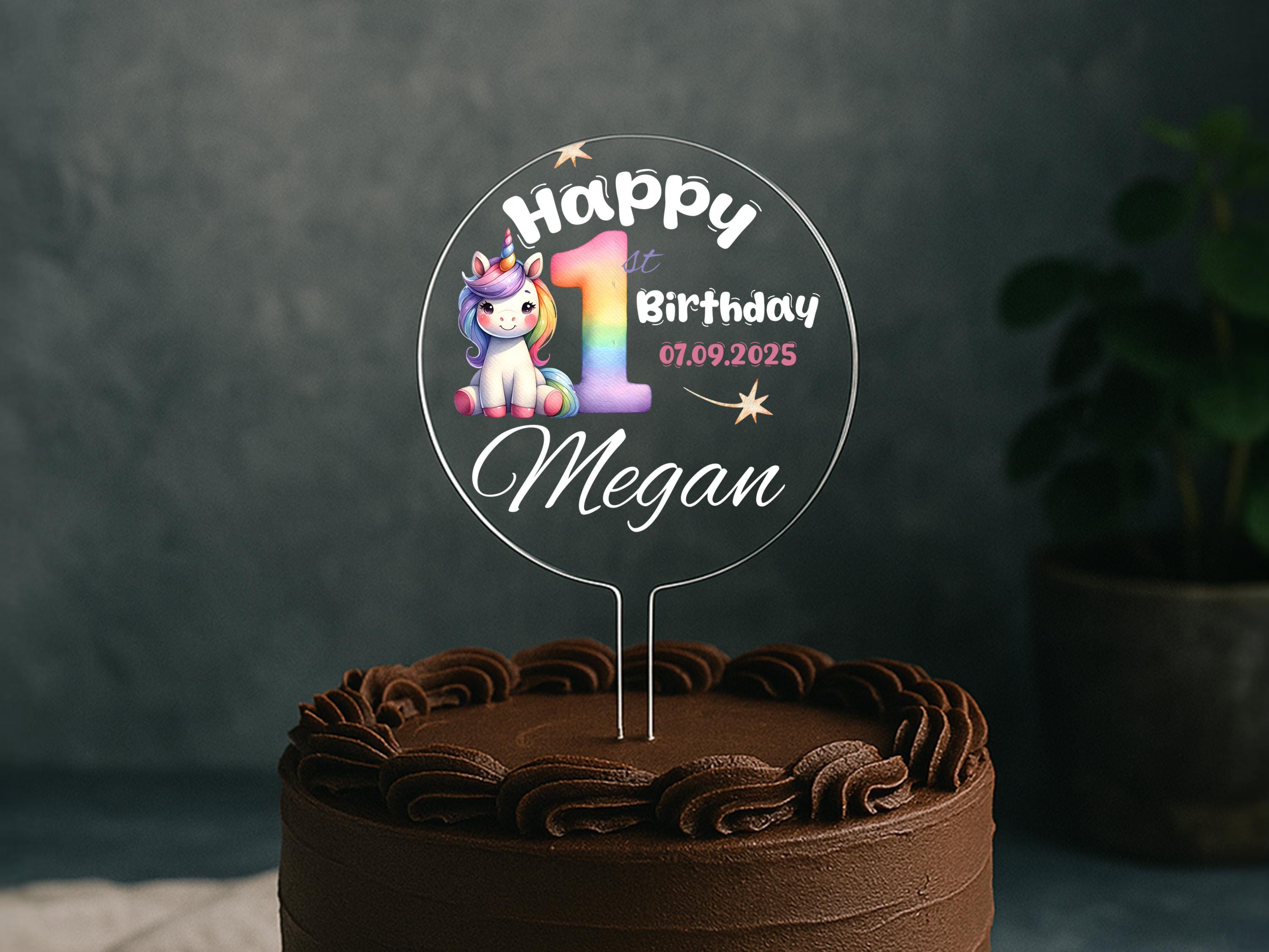 a birthday cake with a happy 1st birthday cake topper