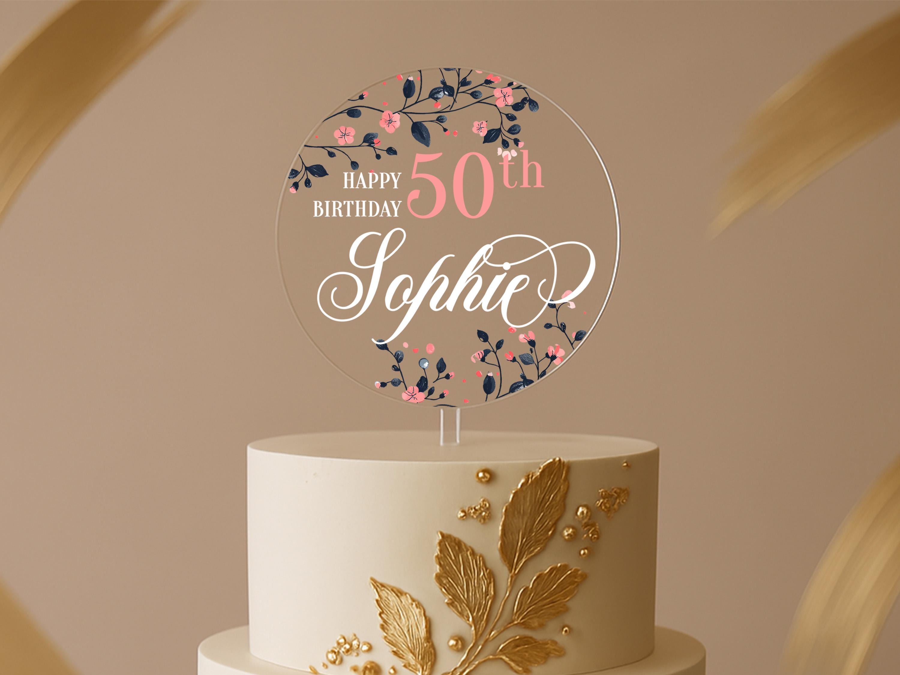Round floral 50th birthday cake topper with navy and pink flowers