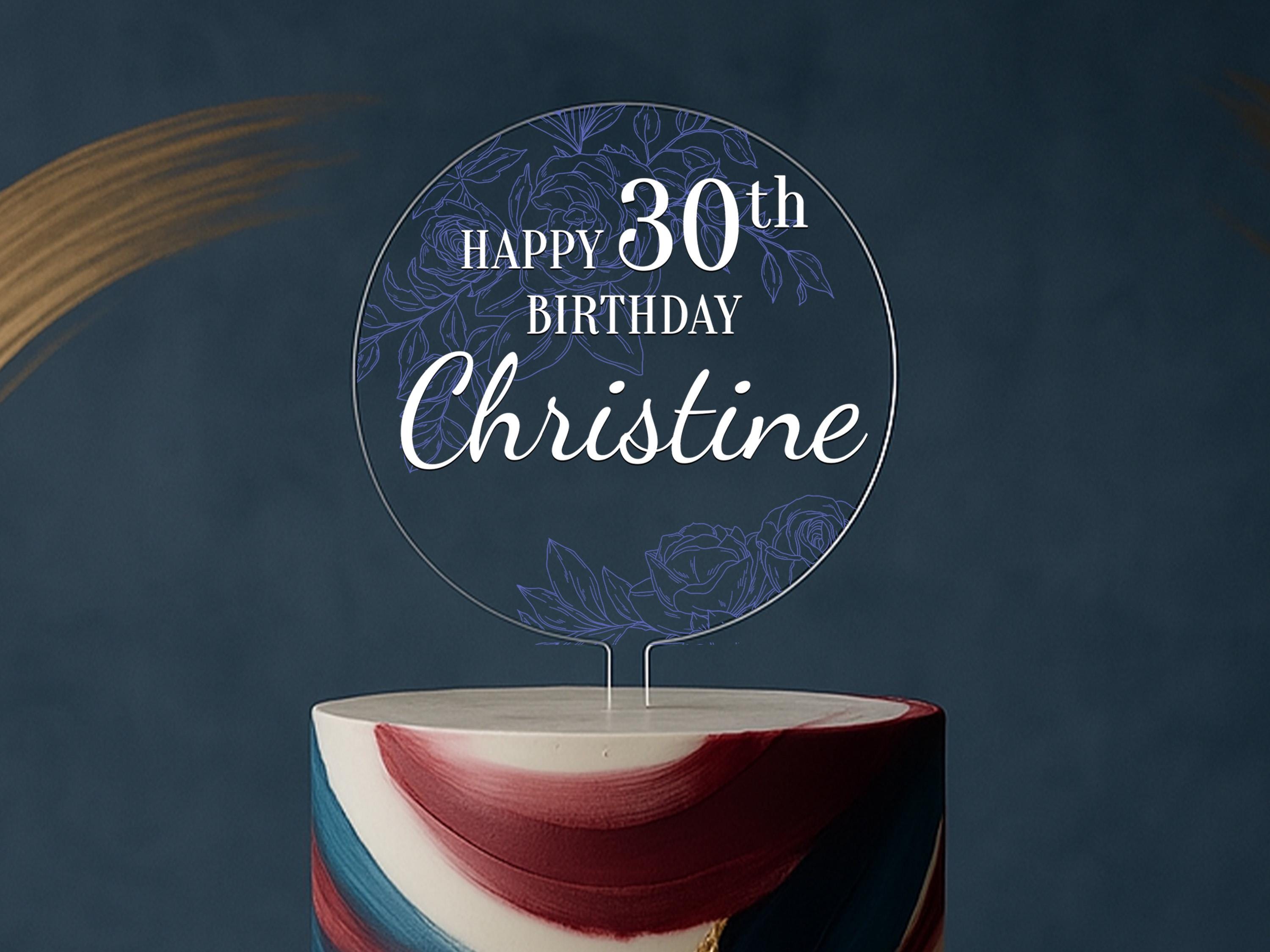 a birthday cake with a sign that says happy birthday christine