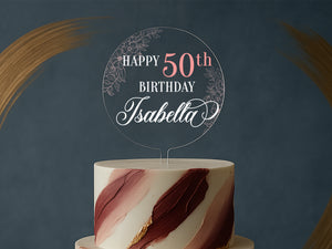 a white and red cake with a happy birthday sign on top