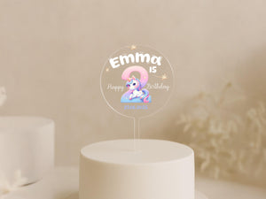 a white cake with a little pony on top of it