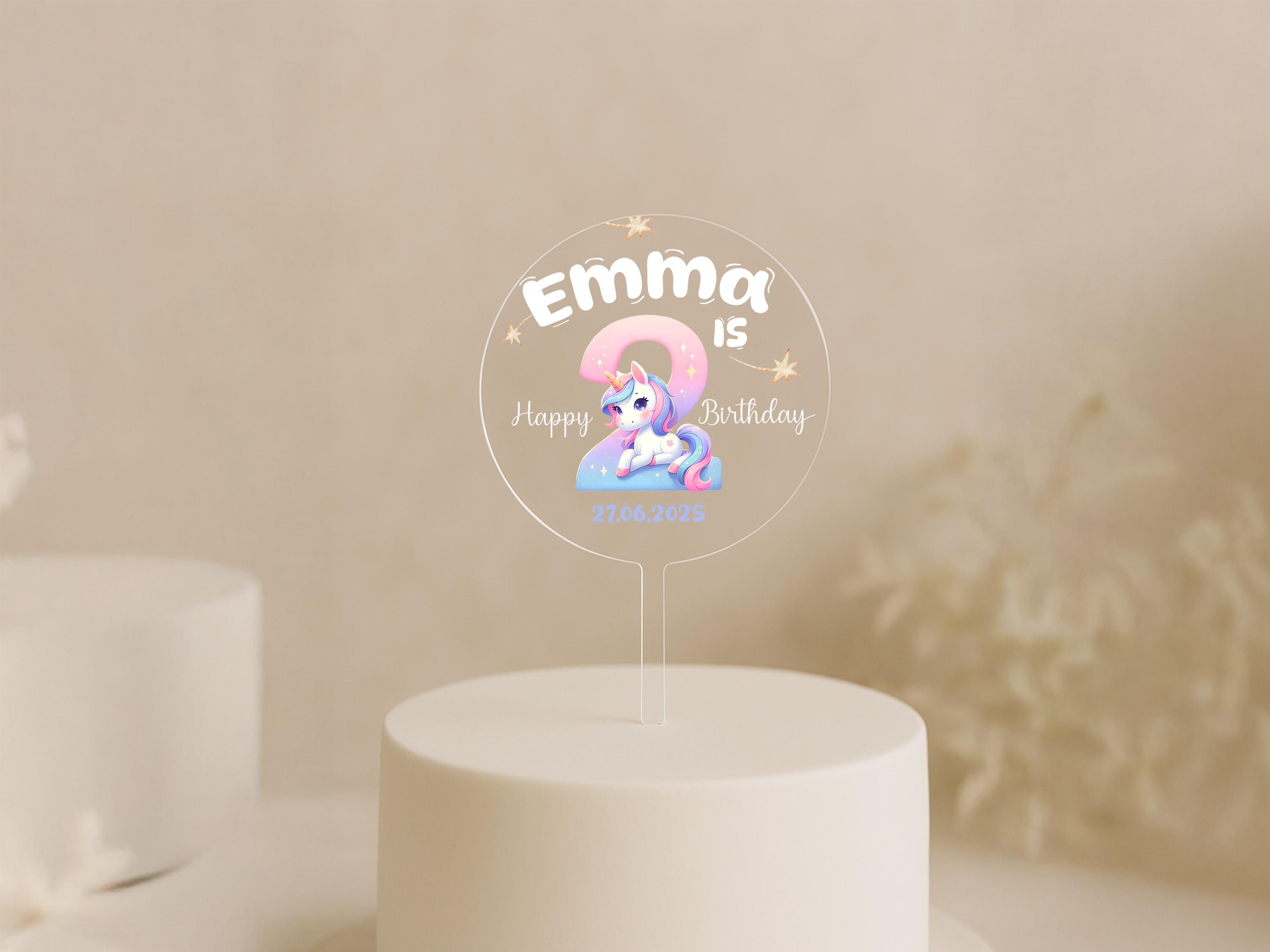 a white cake with a little pony on top of it