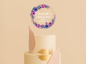 a wedding cake with a floral decoration on top