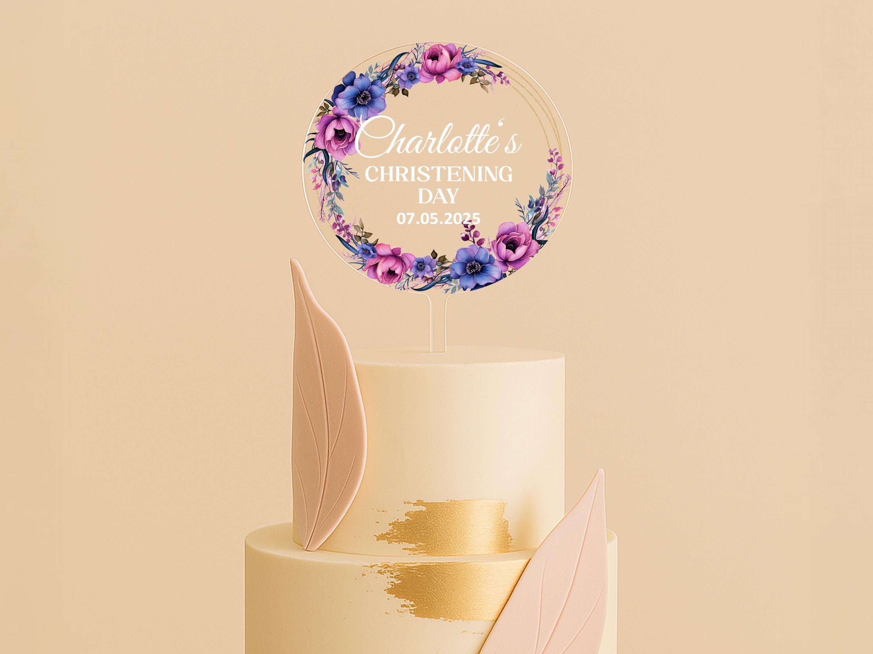 a wedding cake with a floral decoration on top