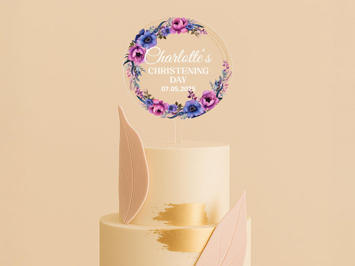 a wedding cake with a floral decoration on top