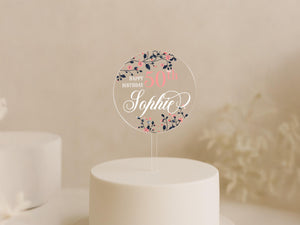 a white cake with a white frosted cake topper