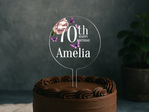 a chocolate cake with a sign that says 70th birthday amelia