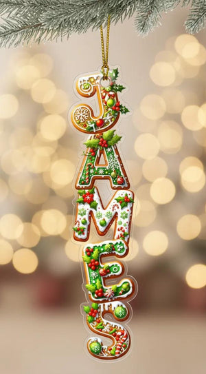 A clear ornament made of colorful candy pieces, with the name "James" spelled out in a festive design.