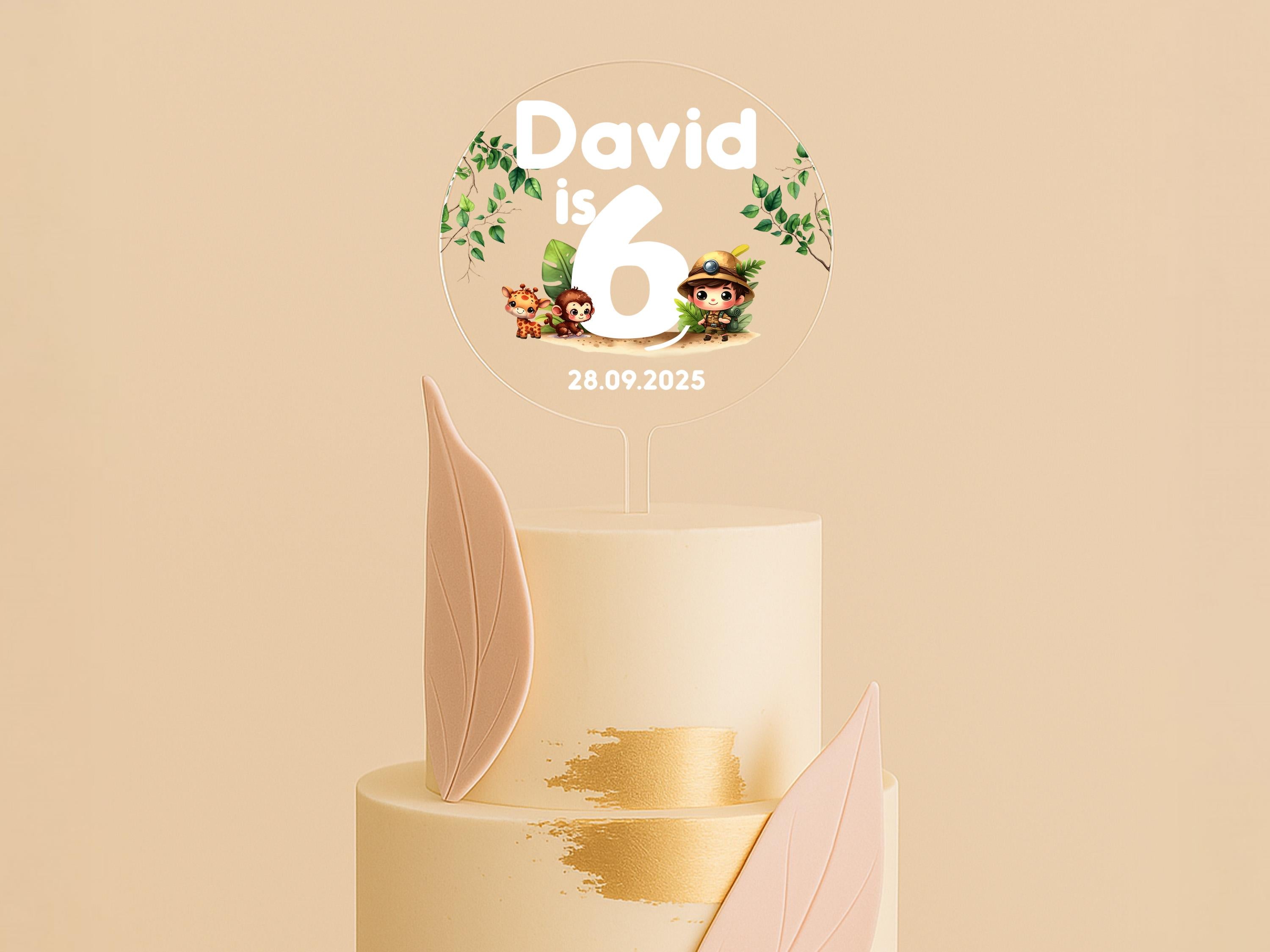 a three tiered cake with a topper on it
