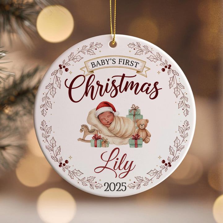 A white Christmas ornament with a baby and a teddy bear, surrounded by a decorative border and the text &quot;Baby&#39;s First Christmas Lily&quot; and &quot;2015&quot;.