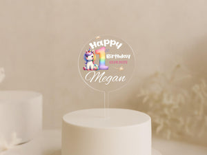 a birthday cake with a unicorn topper on it