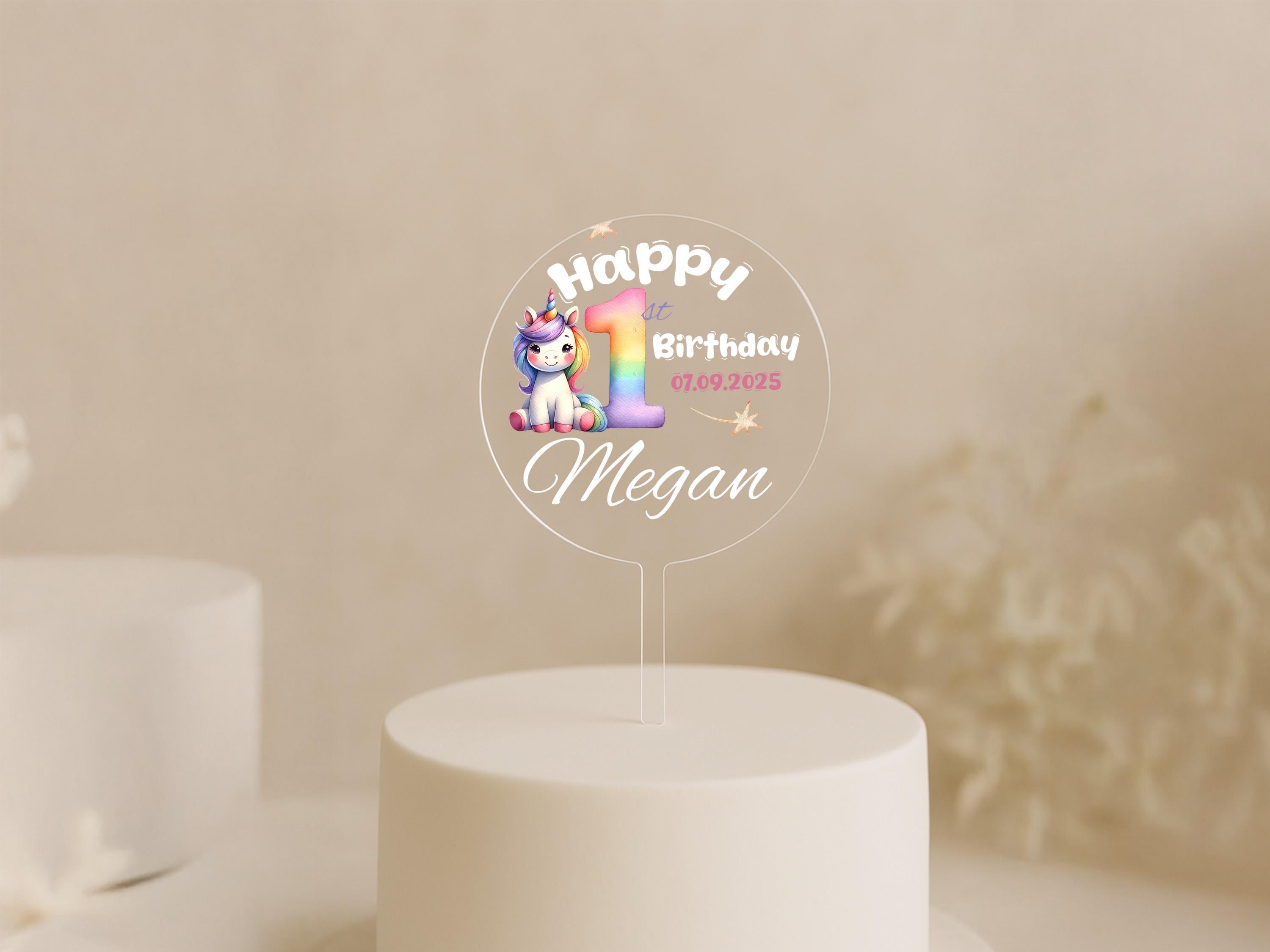 a birthday cake with a unicorn topper on it