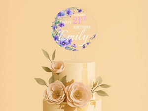 a three tiered cake with flowers on top