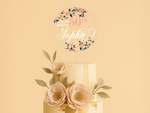 a three tiered cake with flowers on top