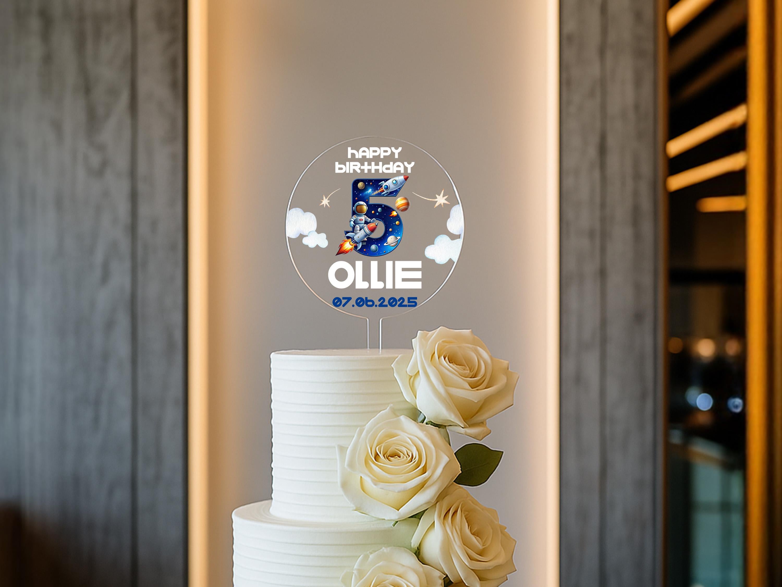 a three layer white cake with white roses on top