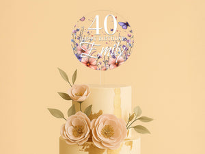 a three tiered cake with flowers on top
