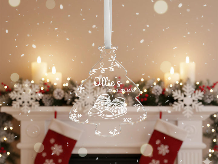 A Christmas ornament with a snowflake design hangs in front of a fireplace, with a blurred background of holiday decorations and lights.