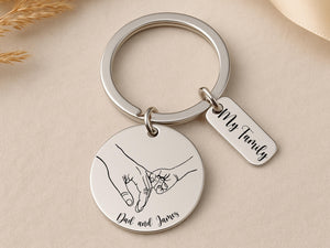 Custom engraved keyring with line art hands and names
