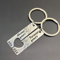Matching engraved couple keychains in rose gold, featuring minimalist hand design and heartfelt love messages