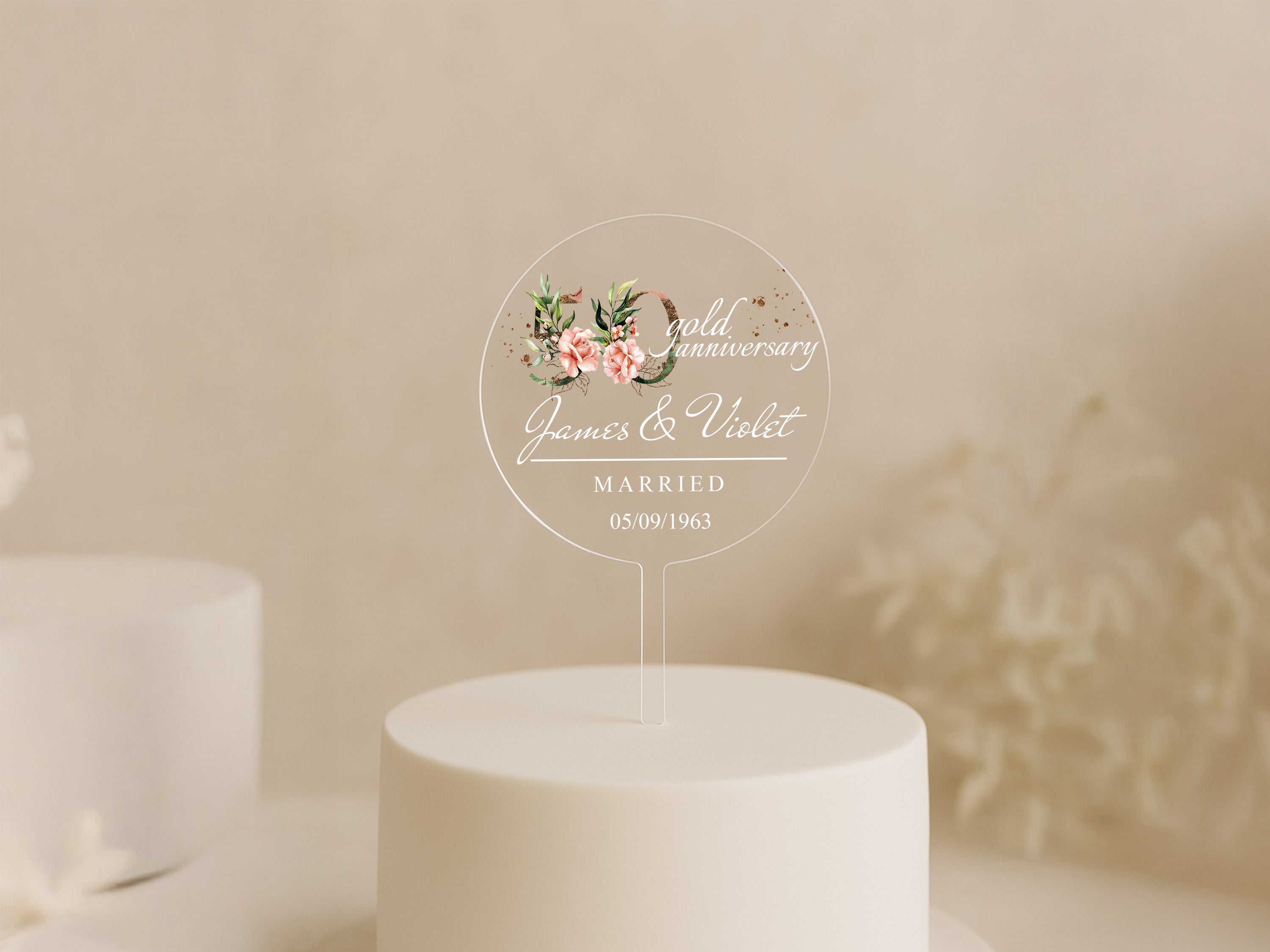 a wedding cake with a white frosted cake topper