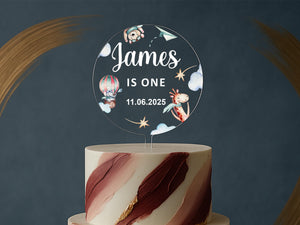 a white and red cake with a name on it